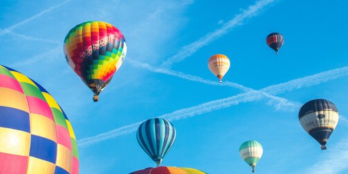 Hot air balloons on a bright blue sunny sky